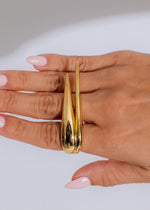 A close-up image of the stunning Aurora Blade Ring Gold with intricate detailing and elegant design