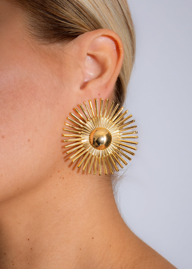 Shimmering and elegant Stellar Radiance Earrings in brilliant gold metal finish