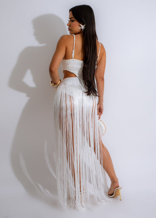  Iconic Girl Fringes Maxi Dress White - Beautiful woman wearing the dress in a garden setting, showcasing its style and fit