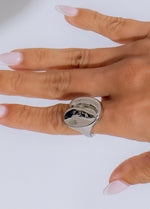 Shiny silver Al Mar ring with intricate floral design and sparkling gemstones