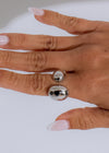 Shiny oval metallic ring silver on a white background