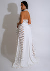 Beautiful white maxi dress with floral embroidery and flowing skirt