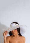 Stylish and elegant white hat with wide brim and ribbon detail