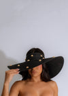 Stylish black hat with wide brim and adjustable strap for women