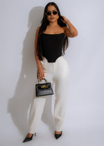 High-waisted white pants with a relaxed fit designed for everyday wear