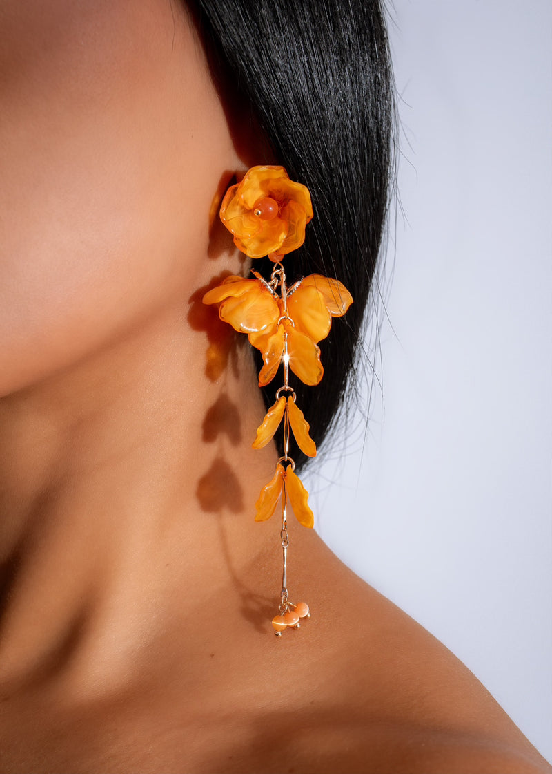 Handcrafted Lunar Bloom Earrings in vibrant orange color, perfect for adding a pop of color to your outfit