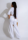 Woman wearing white linen pant with relaxed fit and ankle length