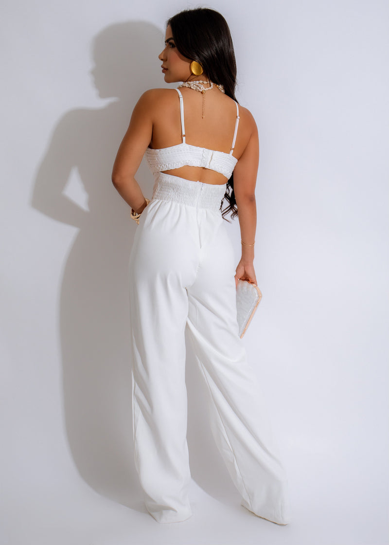  A close-up of the Embroidered Bustier Jumpsuit White, showcasing the beautiful embroidery and detailing on the bodice and waist