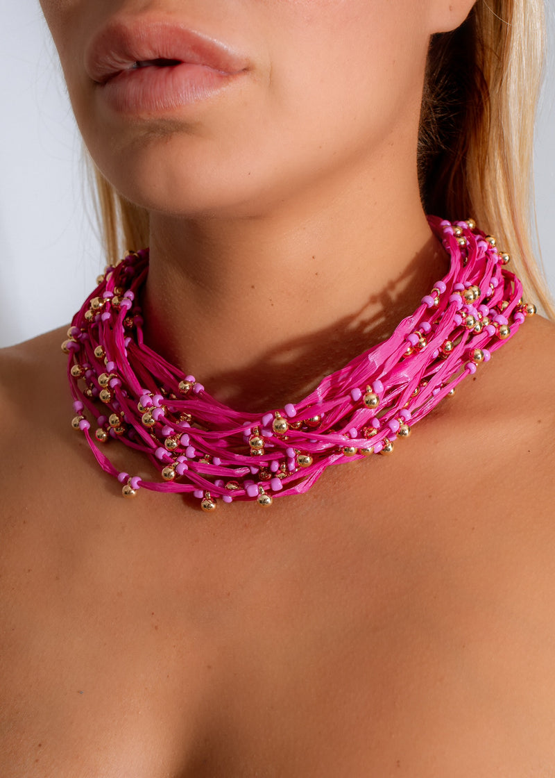 Beautiful pink necklaces perfect for adding a pop of color to your summer outfits