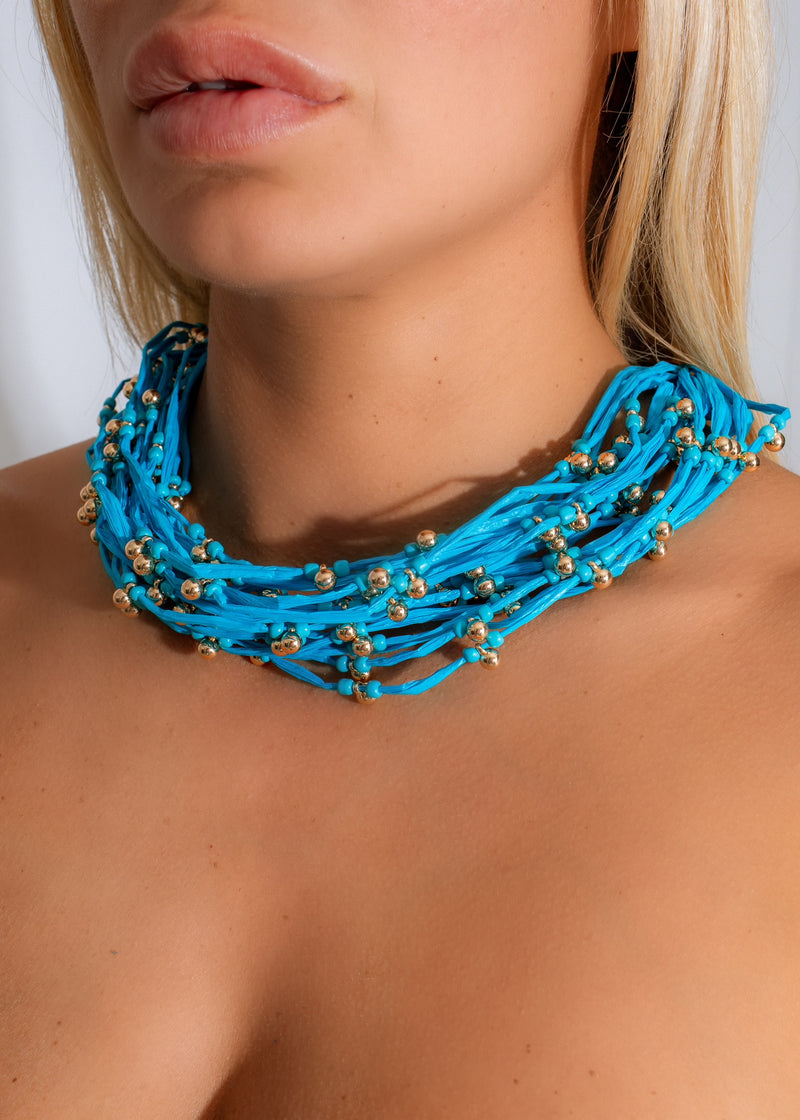 Handcrafted blue beaded necklace perfect for adding a pop of color to your summer wardrobe