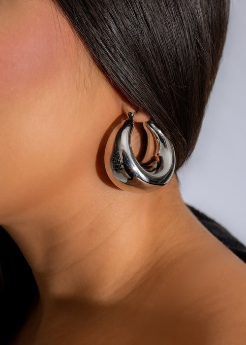 Shiny silver crescent hoops earrings, a stunning accessory for any outfit