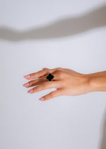 Hand model wearing the stunning black Made You Look Ring with eye-catching details