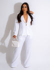 Stylish and elegant white linen blazer with a tailored fit and button details, perfect for a sophisticated and polished look