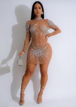 Close-up image of Celestial Mirage Mesh Rhinestones Mini Dress in Nude, featuring intricate rhinestone detailing and a sheer mesh fabric